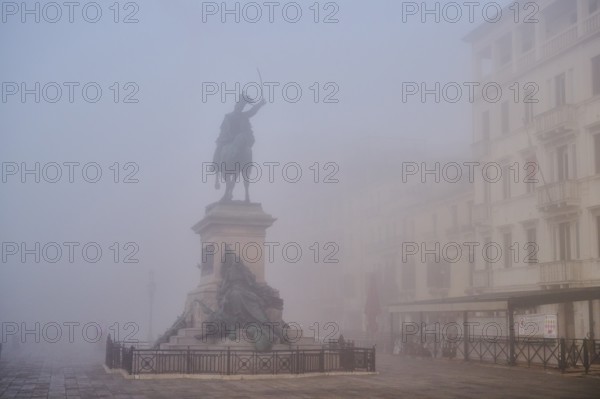 View from 'Riva degli schiavoni' on 'Monumento a Vittorio Emanuee II' before sunrise in Venice on a