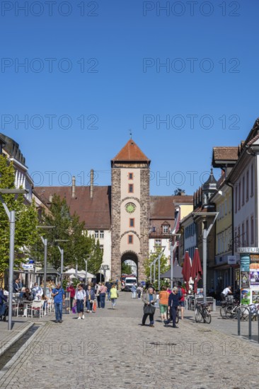 Pedestrian zone, shopping street with the Obertor, historic town gate of Villingen,