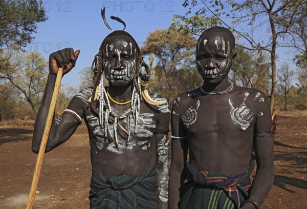 South Ethiopia, in Maco National Park, Mursi tribe, two Mursi boys with painted faces, Ethiopia,