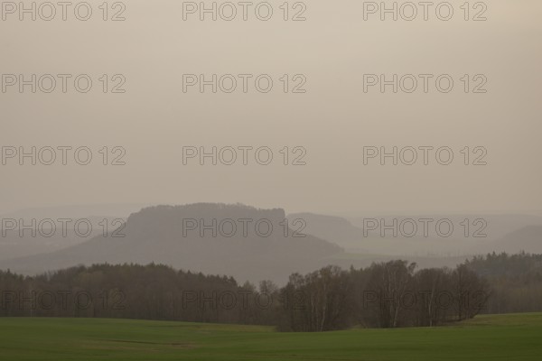 Large amounts of Sahara dust obscure the sun and cloud the distant view to Lilienstein and