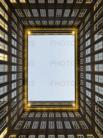 Illuminated inner courtyard of the Kontorhaus Chilehaus in Hamburg's Kontorhaus district at the