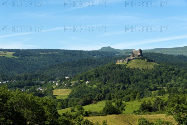 View of the medieval castle of Murol in the Auvergne Volcanoes Regional Natural Park, Puy de Dome,