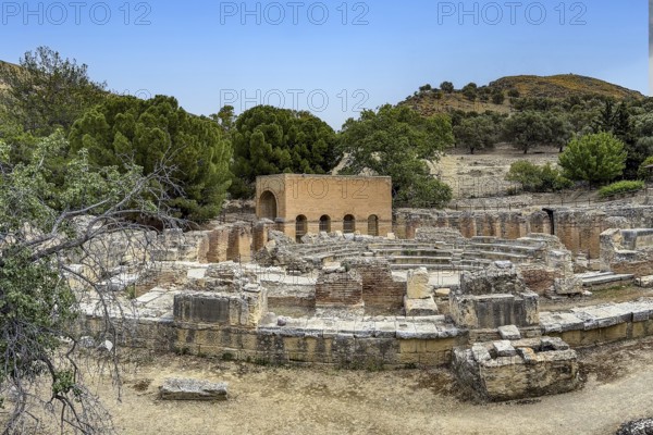 Overview of ruins of historic Roman amphitheatre from antiquity in excavation site remains of