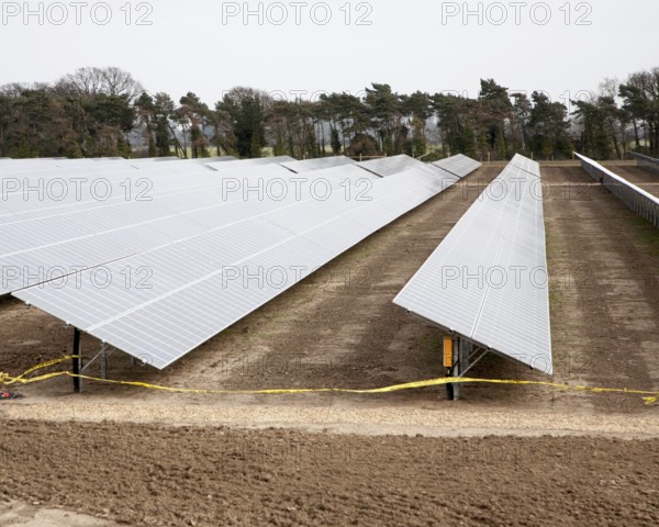 Solar array of photovoltaic panels in a large new solar park at Bucklesham, Suffolk, England,