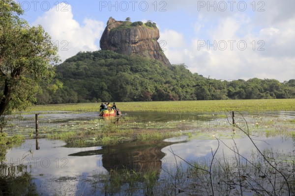 Elephant ride in lake by rock palace, Sigiriya, Central Province, Sri Lanka, Asia