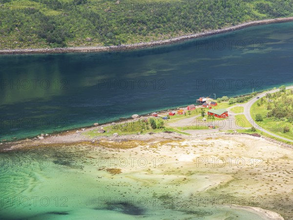 View from mountain range above village Raften down to shore at the Raftsund, the strait between