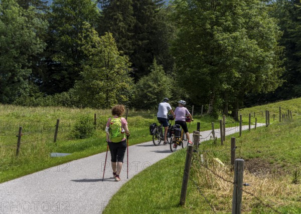 Cyclists and hikers on a circular route on Lake Tegernsee, Bavaria, Germany, Europe