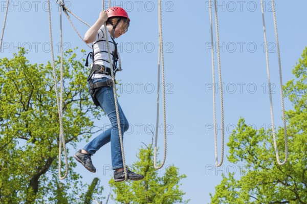 Young girl in climbing park, climbing, action, safety, belay, belay rope, belay technique, belay