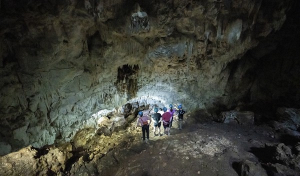 Tourists in a stalactite cave, Terciopelo Cave, Barra Honda National Park, Costa Rica, Central