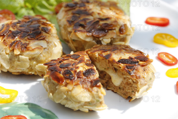Swabian cuisine, meatballs wrapped in almonds, mixed minced meat, meatballs filled with cheese,