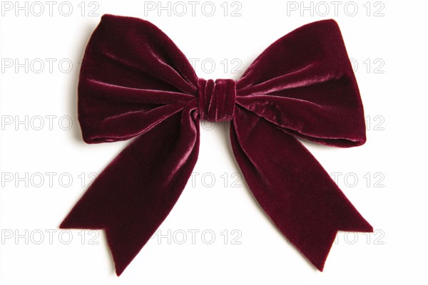 Beautiful dark burgundy red velvet ribbon on white background. Generative AI, AI generated