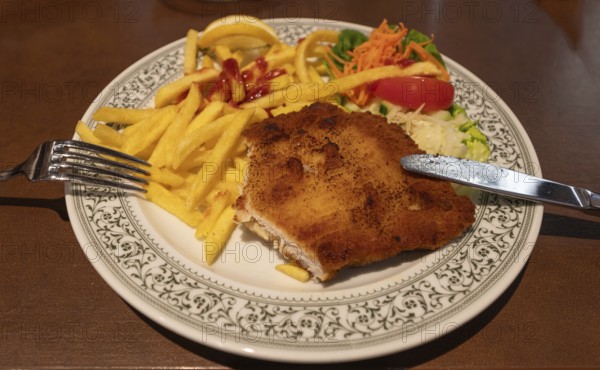 Breaded Wiener Schnitzel with French fries, Bavaria, Germany, Europe