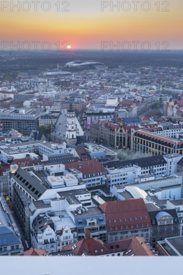 View of the city from the City Tower at sunset, St Thomas' Church, Red Bull Arena and Auwald