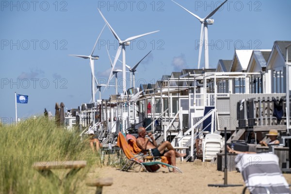 Wind turbines, wind farm, holiday homes, beach houses on the beach of Ijmuiden in North Holland,