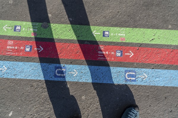 Signpost on the pavement, for bus and train diversions at Dortmund Central Station, during