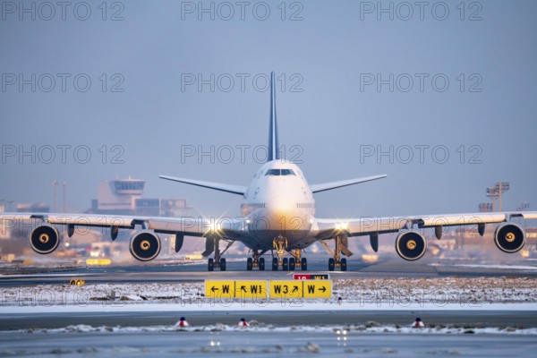 Lufthansa Boeing 747-8, on the taxiway to Runway West, Frankfurt FRA Airport, Fraport, in winter,