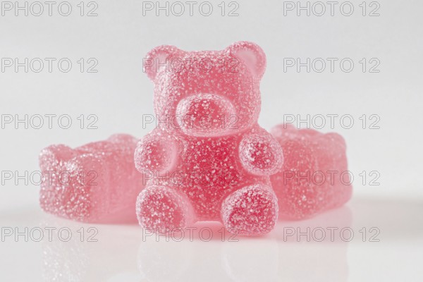 Cute opink jelly bear fruit gum candies with sugar on white background. Generative Ai, AI generated