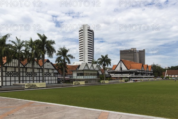 Modern buildings and green field in the city centre of Kuala Lumpur, Malaysia, Asia