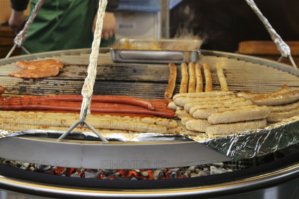 Sausages and steaks on the swing grill