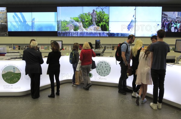 People inside tourist information office, Plaza Mayor, Madrid city centre, Spain, Europe