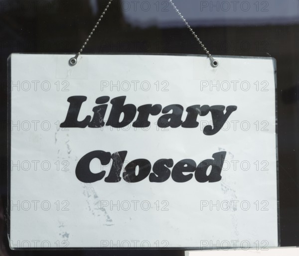 Sign saying 'Library Closed' symbolising closure of libraries as a result of austerity government