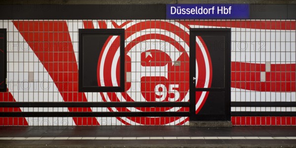 Large logo in club colours of Fortuna Düsseldorf on a wall with tiles, Düsseldorf Central Station,