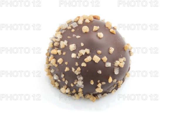 Single chocolate candy isolated on white background. side view, close up