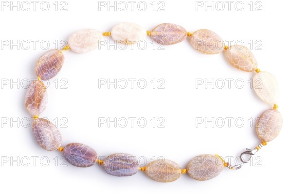 Dragon vein agate colored beads isolated on white background. top view, close up