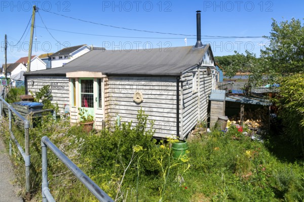 Seaside chalet beach bungalow buildings at Felixstowe Ferry, Suffolk, England, Uk