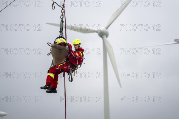 Height rescuers from the Oberhausen professional fire brigade practise abseiling from a wind