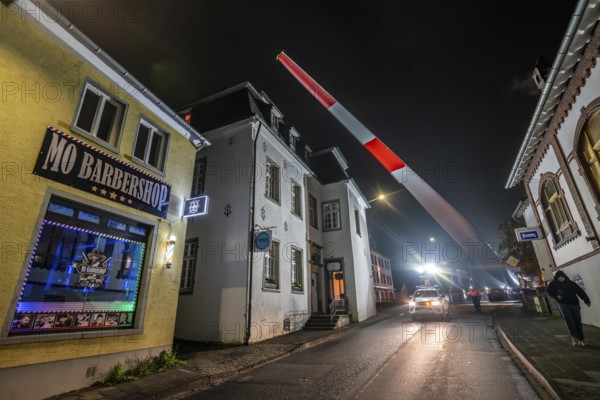 Transport of a 68 metre long, 22 tonne blade of a wind turbine, here in Breckerfeld, with a