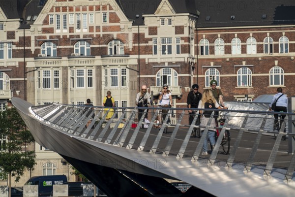 Cyclists on the Lille Langebro cycle and pedestrian bridge over the harbour, Copenhagen is