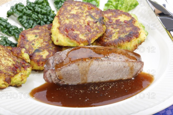 Swabian cuisine, medallions of wild boar with savoy cabbage cakes, meat dish, roasted, hearty, home