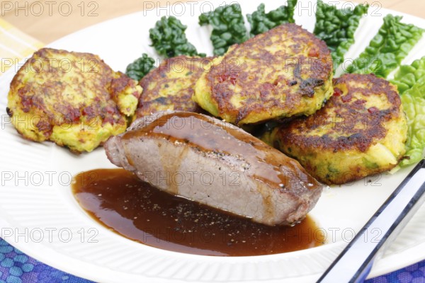 Swabian cuisine, medallions of wild boar with savoy cabbage cakes, meat dish, roasted, hearty, home