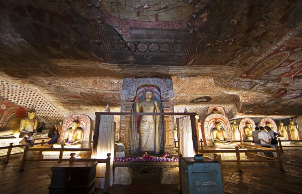 Buddha statues and ceiling fresco in the Dambulla cave temple, Dambulla, Central Province, Sri