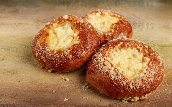 Bun with cottage cheese, pastries, cheesecake, no people