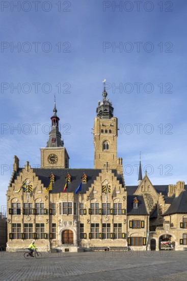 Market square showing town hall with belfy and St Nicholas Church tower, rebuilt after WWI in the