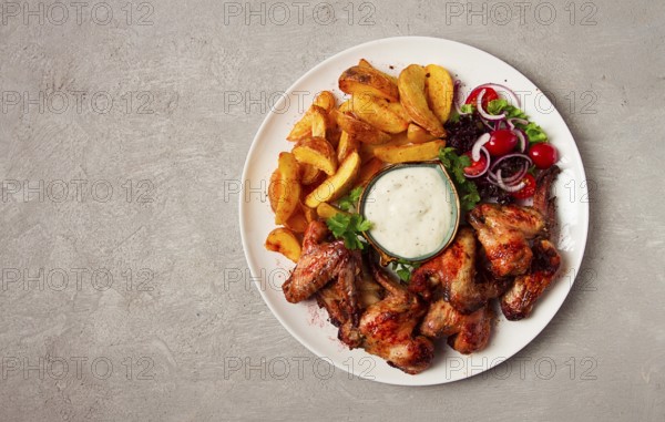 Fried chicken wings, with potatoes, and spices, homemade, fast food, no people