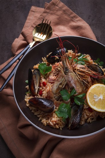 Seafood paella, shrimp and mussels risotto, rice, homemade, top view, no people
