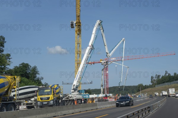 Construction cranes at a building site on the A6 motorway, Bavaria, Germany, Europe