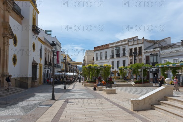 Picturesque Spanish street with historic buildings and relaxed atmosphere, Plaza del Socorro, Old