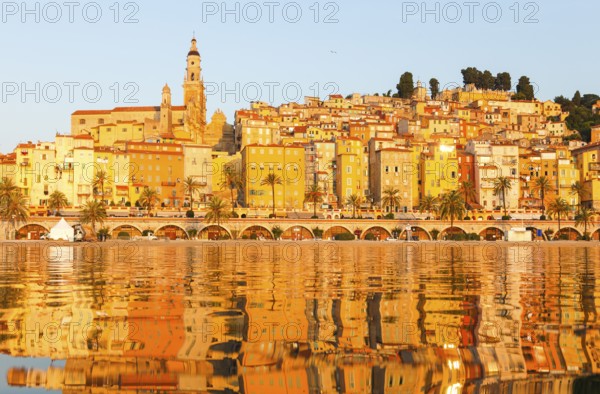 The town of Menton reflected in the sea, Menton, Côte d'Azur, Provence, France, Europe