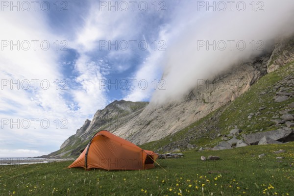 Tent at the foot of a rock face, Buneset, Moskenesöya, Lofoten, Nordland, Norway, Lofoten, Norway,