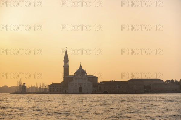 View over the water to the church of San Giorgio Maggiore, at sunrise, Venice, Veneto, Italy,