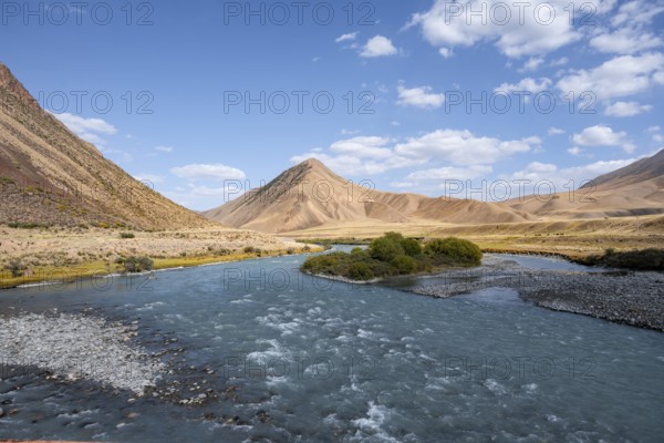Burkhan valley with blue river, mountain landscape with golden meadows, Terskey Ala-Too, Tien Shan,
