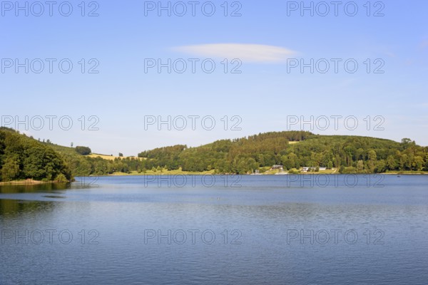 View over the Hennesee, blue sky with a cloud, Hennetalsperre, Naturpark Sauerland-Rothaargebirge,
