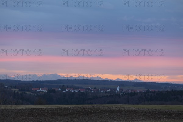Alpine panorama near Magolsheim. Säntis, Swiss Alps at sunset with a view of Mehrstetten. View from