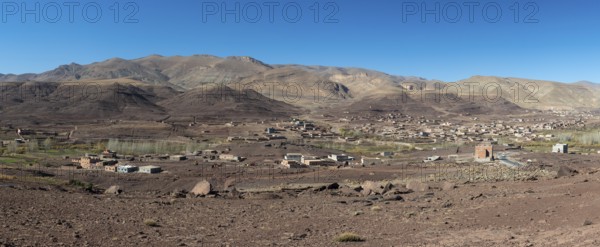 View of Taboulmante with colourful mountains in the background, layered landscape, Gorges du Dades,