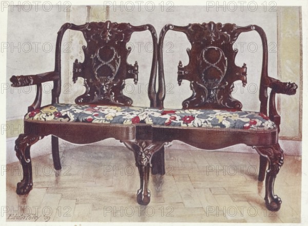 Furniture around the turn of the century 1900, Carved walnut darby and Joan settee (1910, 1911),