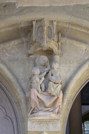 Sculpture of St Anne the Third, St Anne with her daughter Mary and the infant Jesus, above the